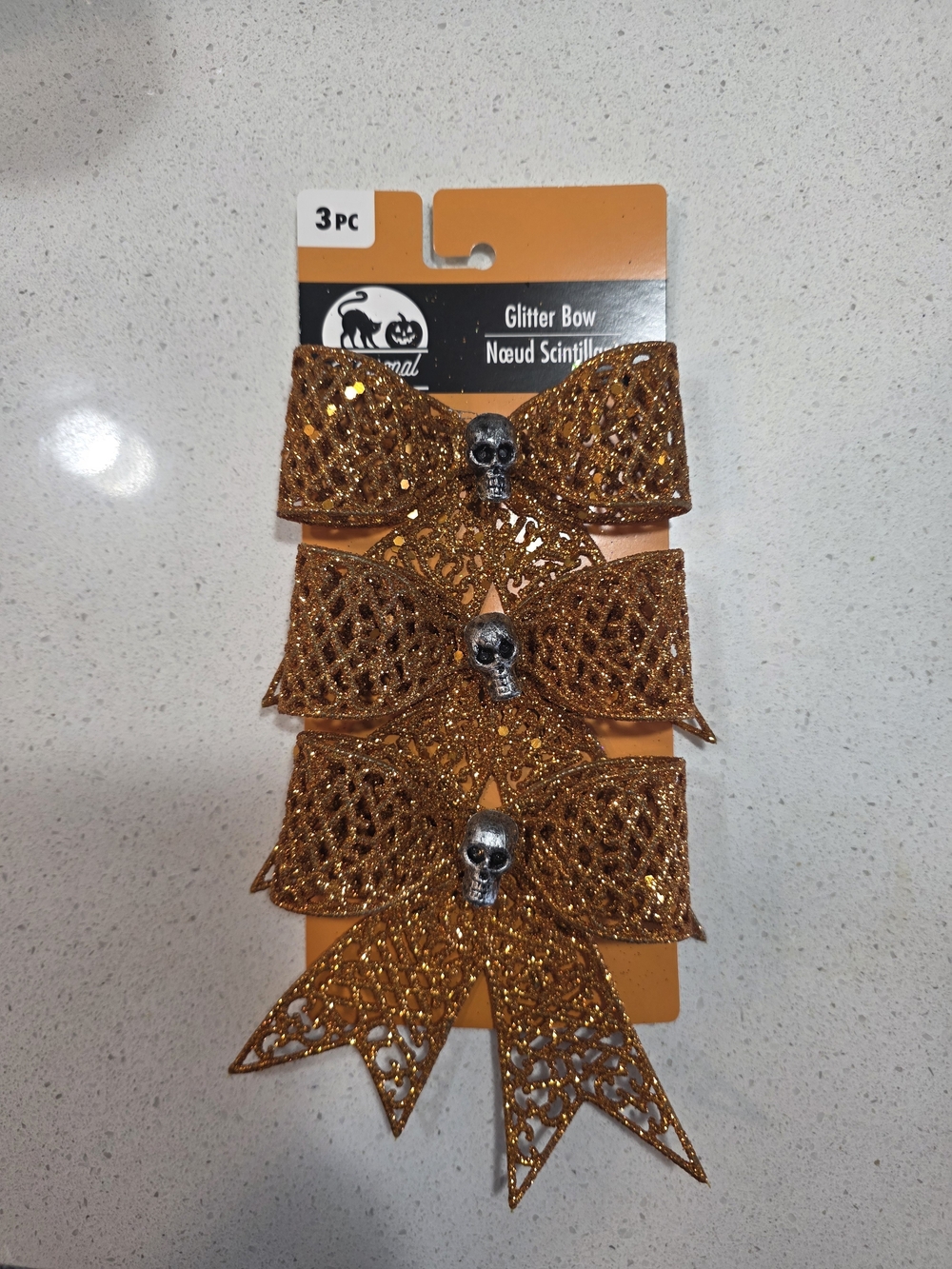 Expressions Metallic Orange Glitter Bows  with Skull Accent